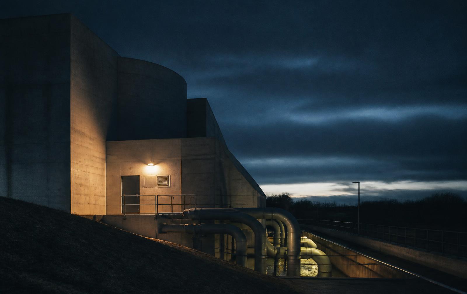 Concrete water treatment plant at dusk